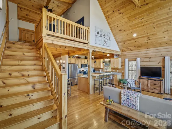 a view of balcony with wooden floor and seating space