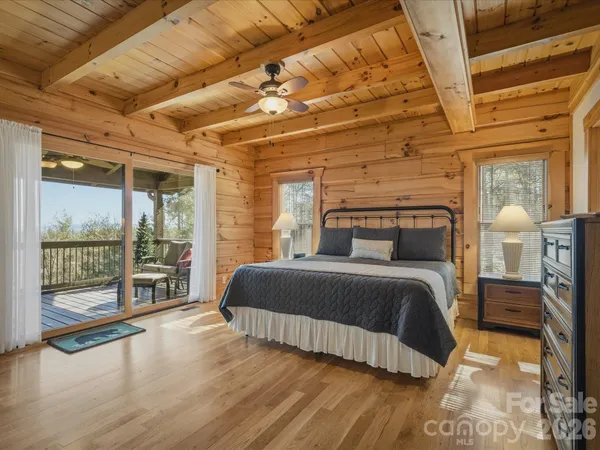 a bathroom with a sink a mirror a toilet and a shower