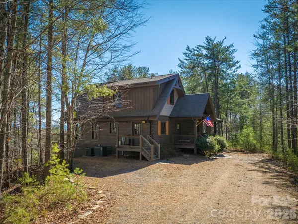 a view of house with outdoor seating area