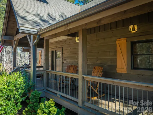 a view of a white house with a large window