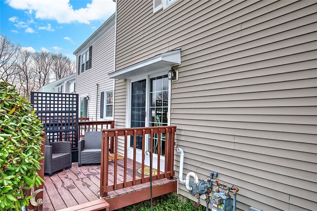 2970 Mendon Road, Unit 17 Cumberland, RI 02864 - Photo 35 of 48 Side deck - slider from the kitchen