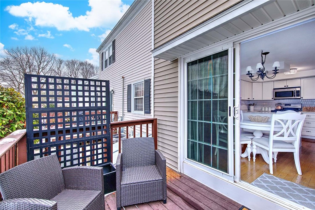2970 Mendon Road, Unit 17 Cumberland, RI 02864 - Photo 36 of 48 Side deck - slider from the kitchen