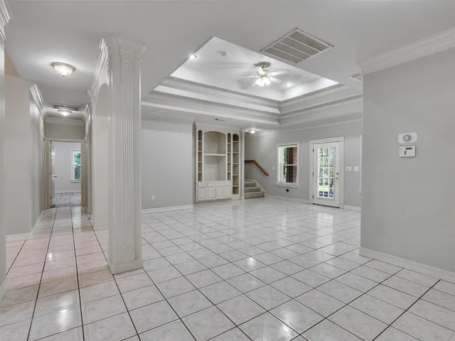 a view of a hallway with chandelier and entryway