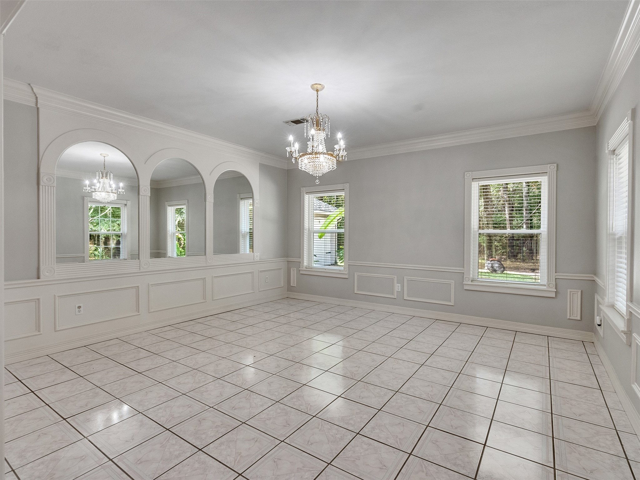 22872 Mersey Court Porter, TX 77365 - Photo 14 of 48 an empty room with windows and chandelier