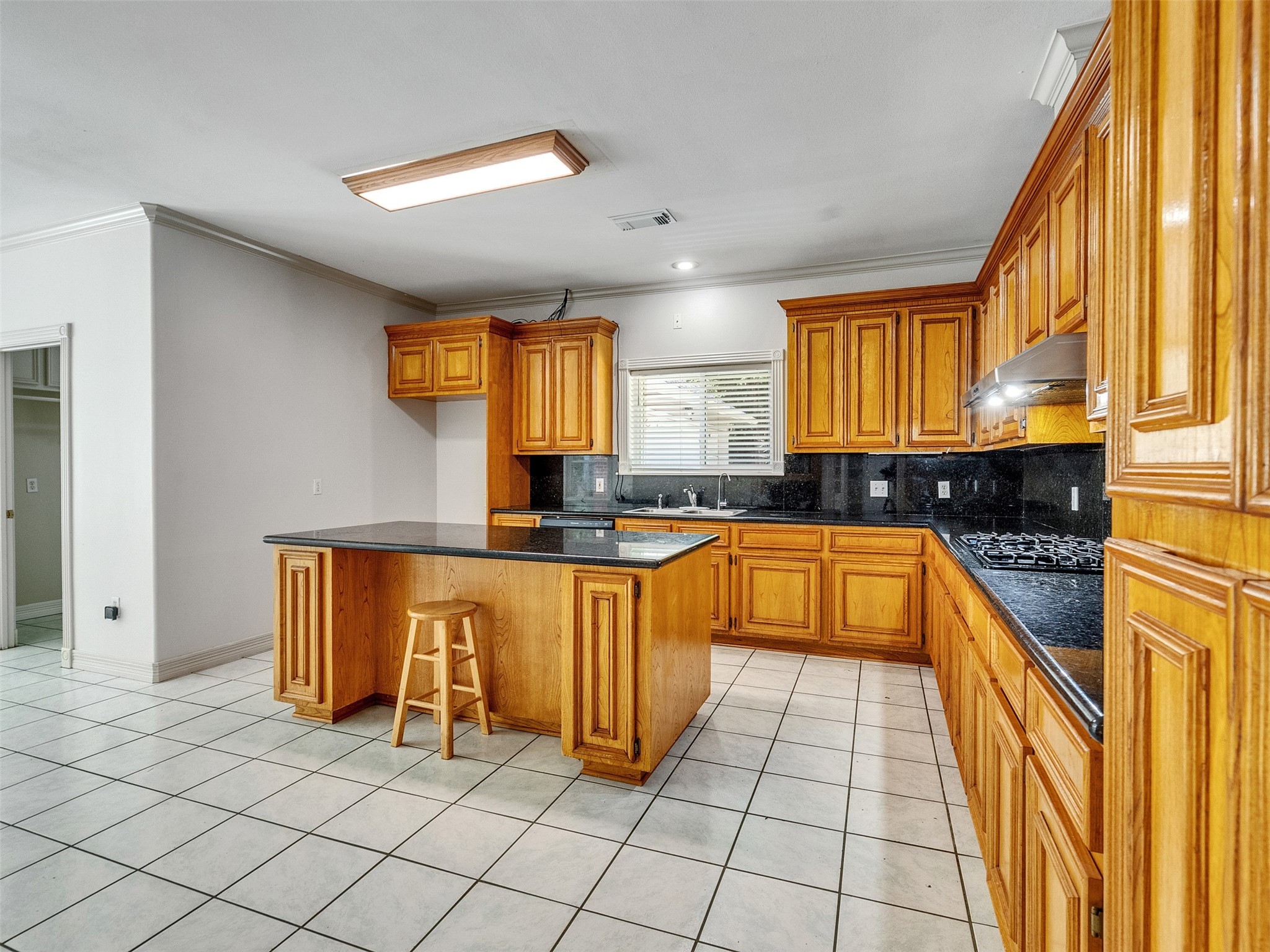 22872 Mersey Court Porter, TX 77365 - Photo 16 of 48 a large kitchen with a window and cabinets