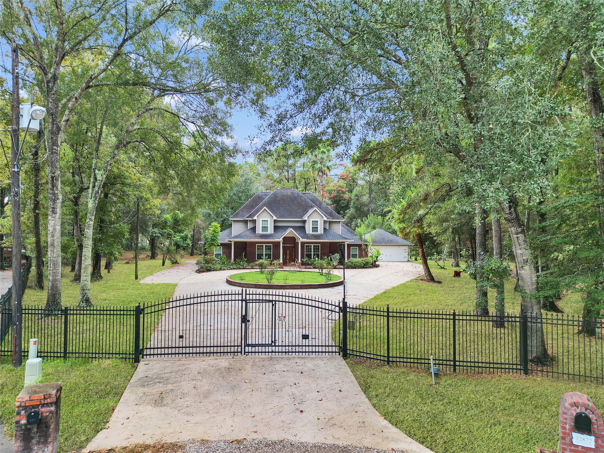 22872 Mersey Court Porter, TX 77365 - Photo 2 of 48 a front view of a house with garden
