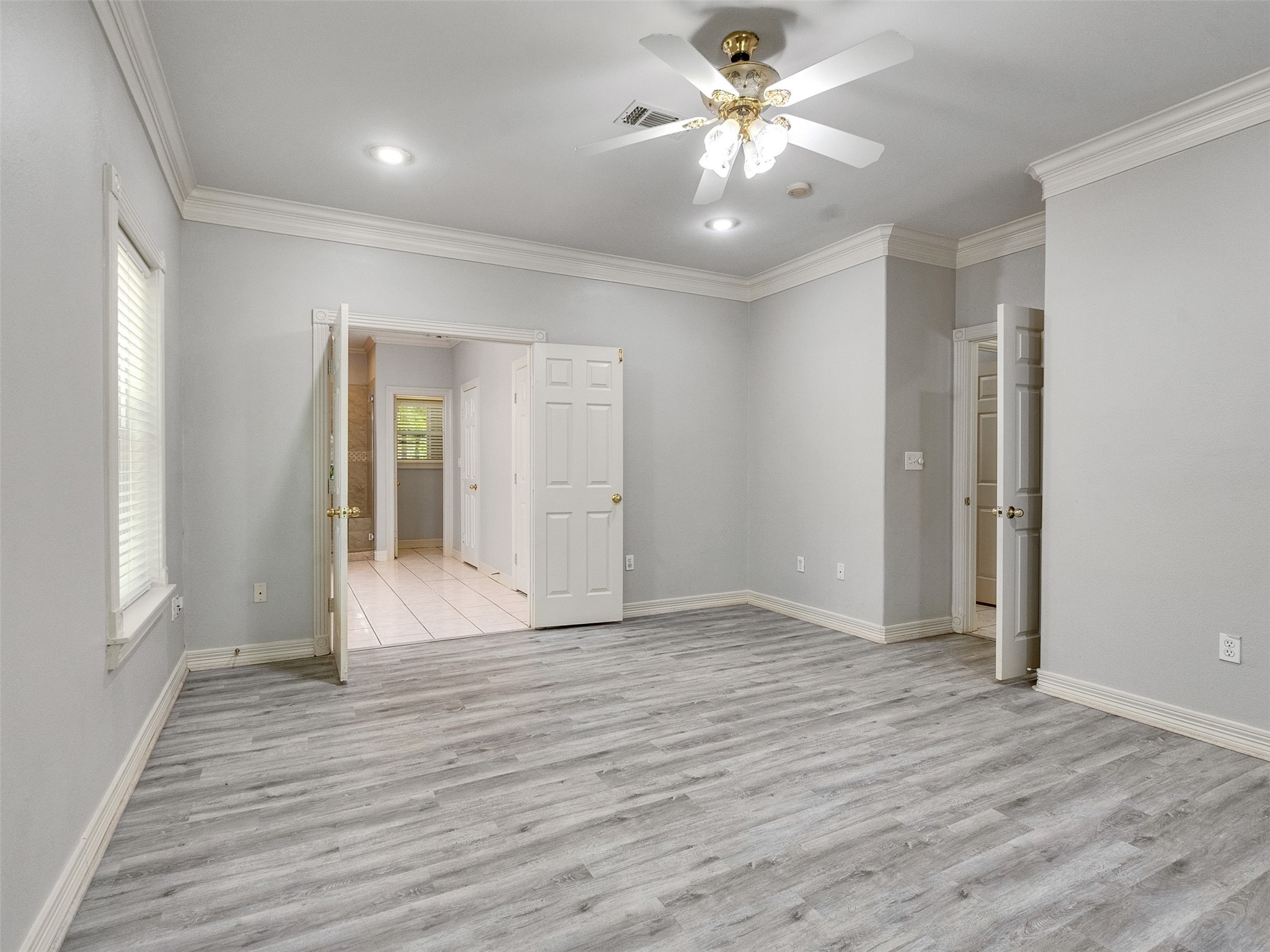 22872 Mersey Court Porter, TX 77365 - Photo 23 of 48 an empty room with wooden floor and ceiling fan