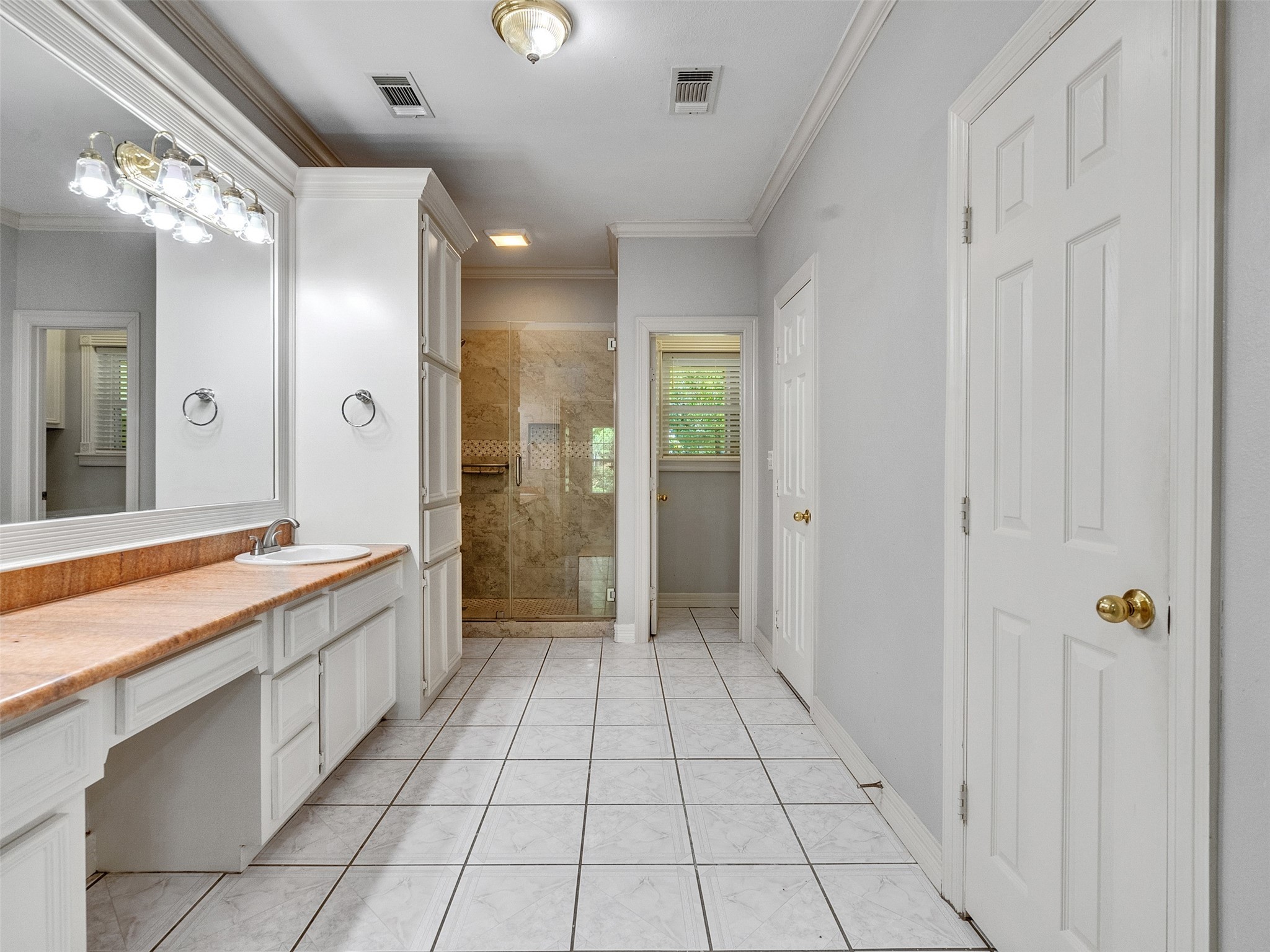 22872 Mersey Court Porter, TX 77365 - Photo 25 of 48 a large bathroom with a glass shower door and a sink