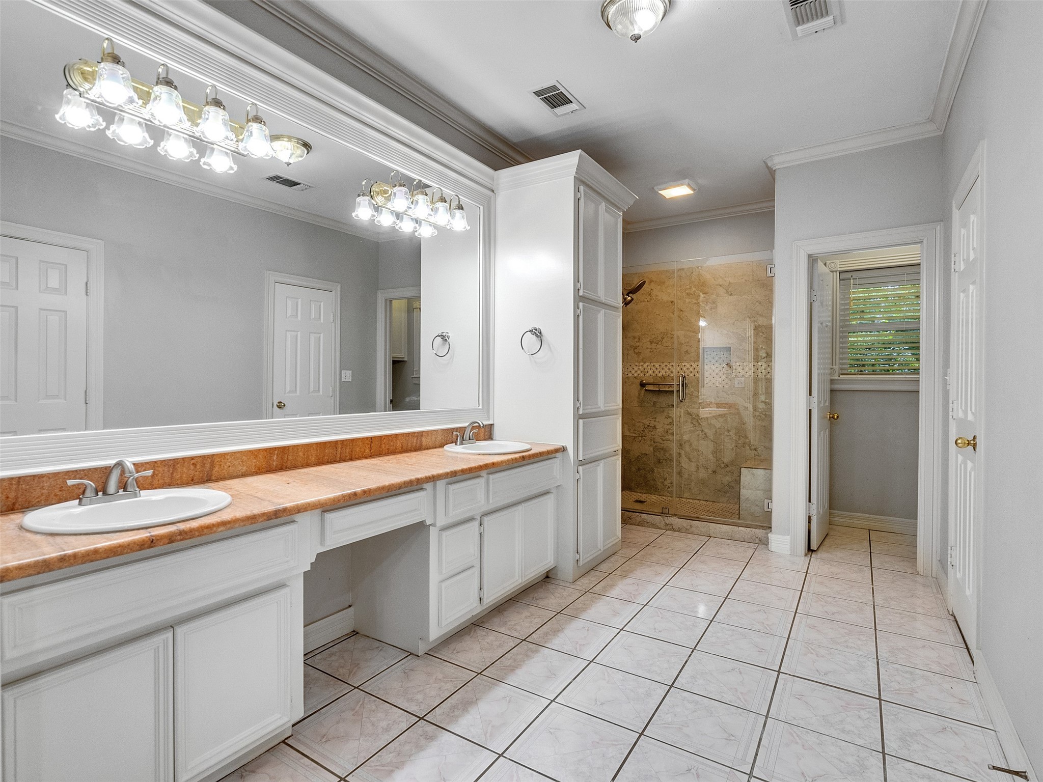 22872 Mersey Court Porter, TX 77365 - Photo 26 of 48 a spacious bathroom with a shower a sink and a mirror