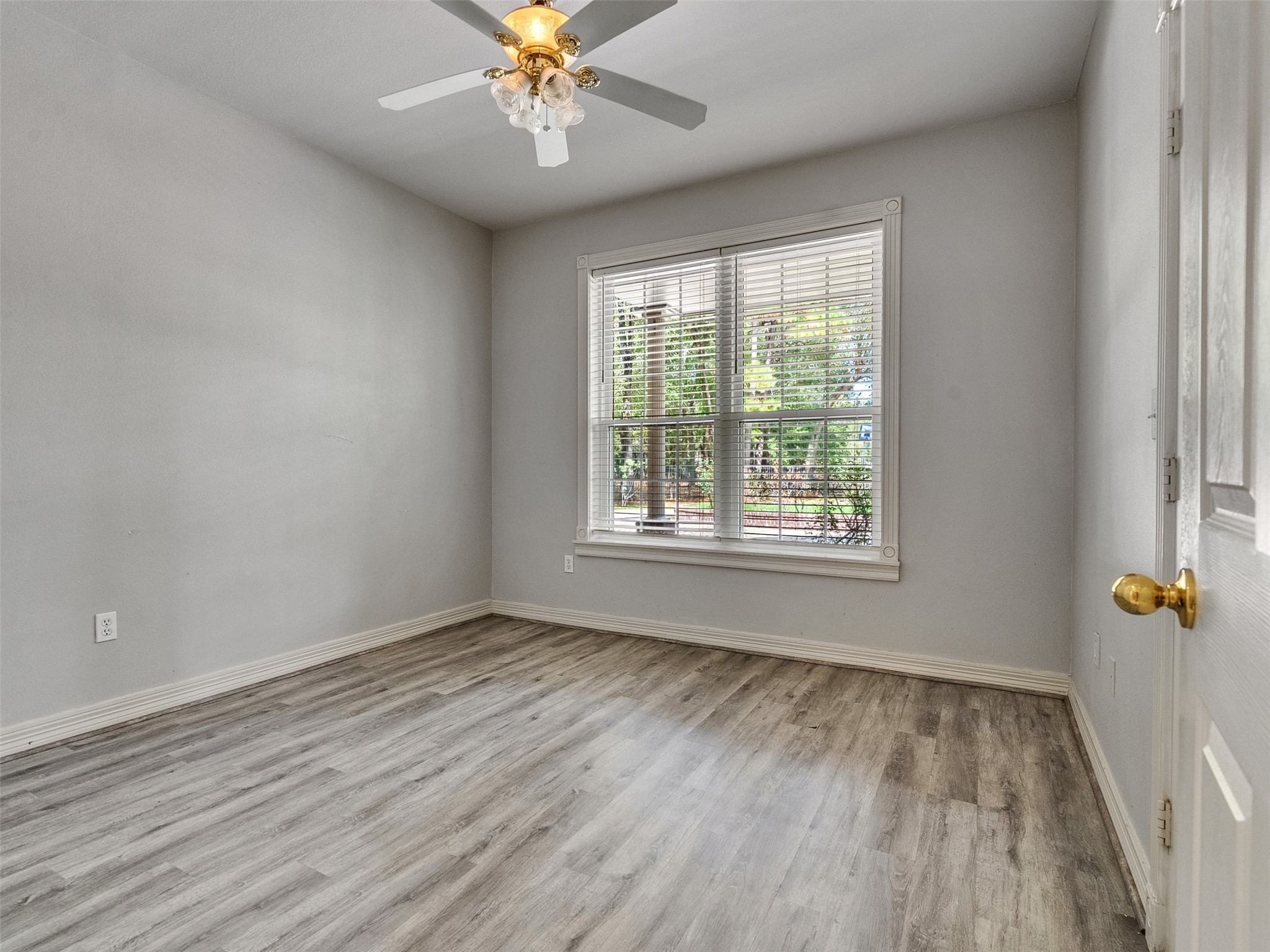 22872 Mersey Court Porter, TX 77365 - Photo 29 of 48 a view of an empty room with a window and wooden floor