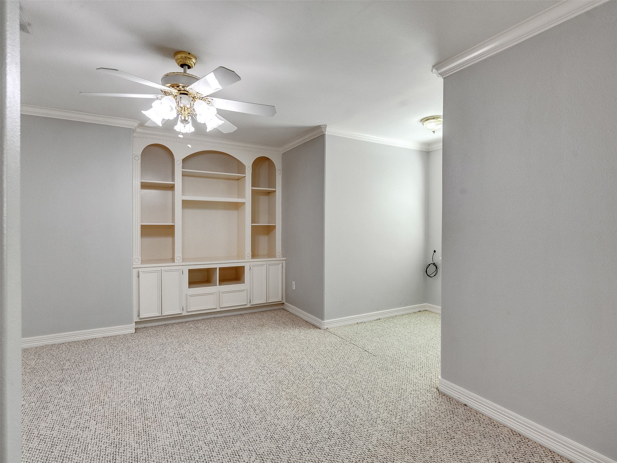 22872 Mersey Court Porter, TX 77365 - Photo 34 of 48 a view of an empty room with a chandelier fan