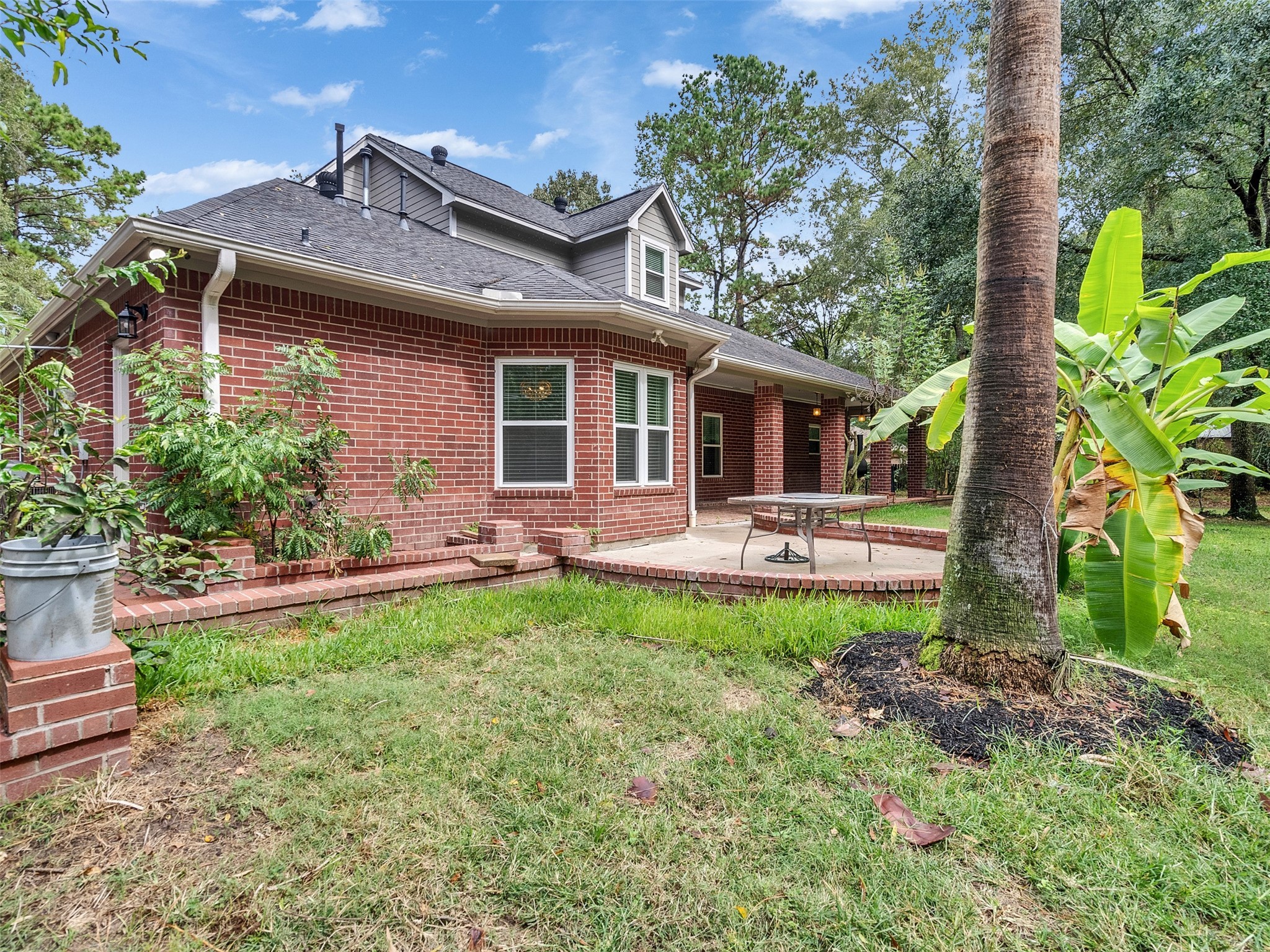 22872 Mersey Court Porter, TX 77365 - Photo 39 of 48 a front view of a house with garden