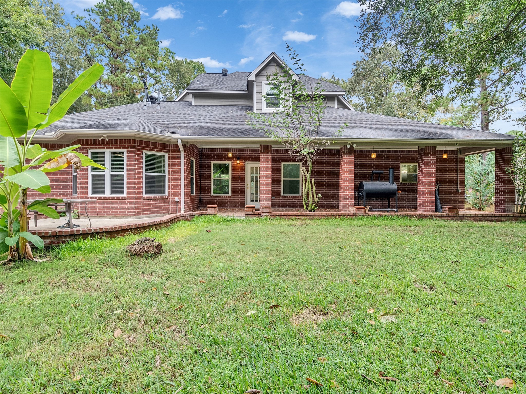 22872 Mersey Court Porter, TX 77365 - Photo 40 of 48 front view of a brick house with a yard
