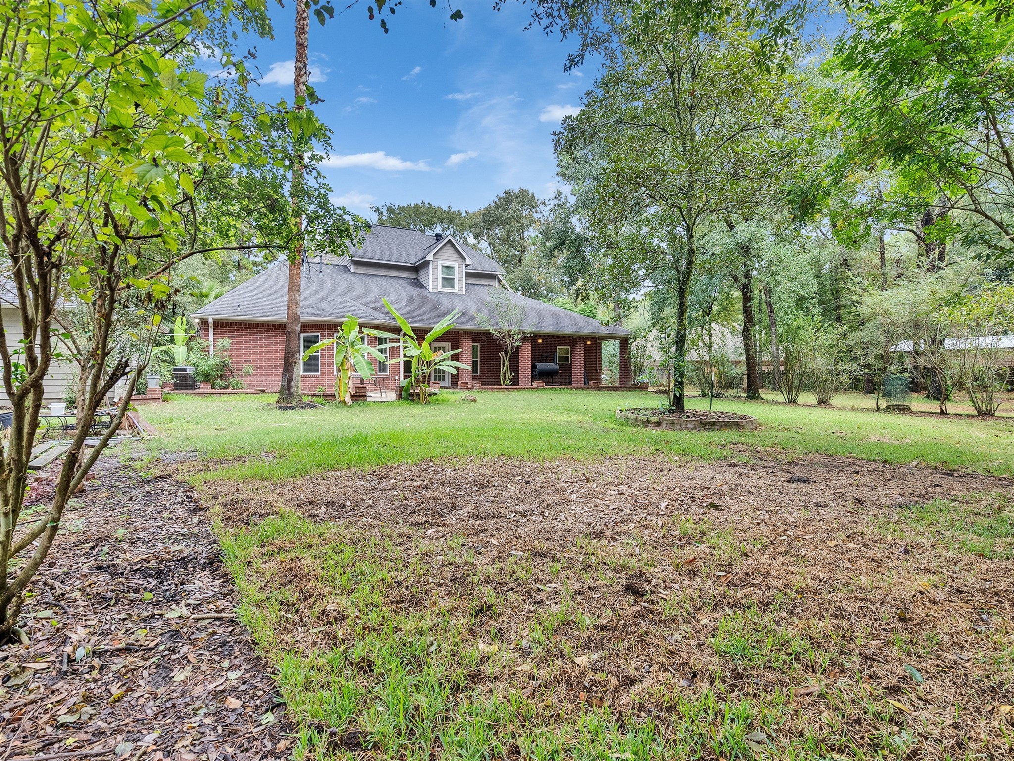 22872 Mersey Court Porter, TX 77365 - Photo 41 of 48 a view of house with garden