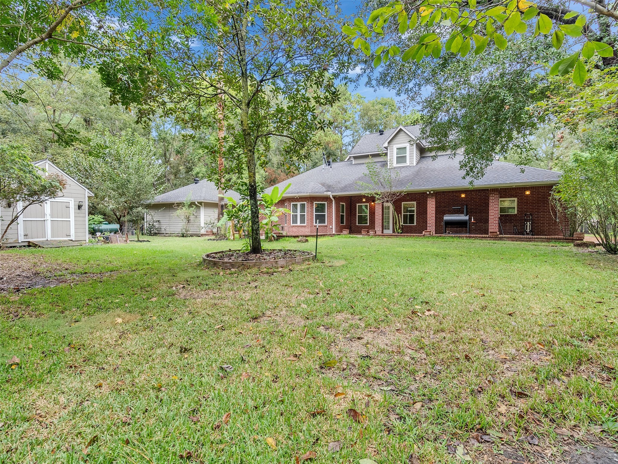 22872 Mersey Court Porter, TX 77365 - Photo 42 of 48 a view of a house with a yard