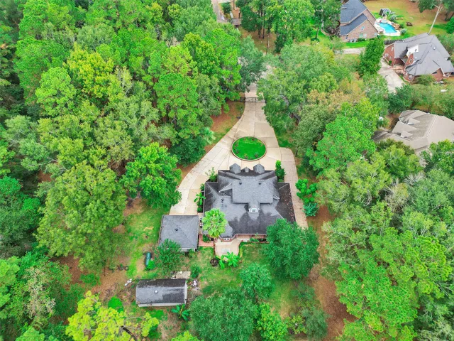 an aerial view of a house with a garden