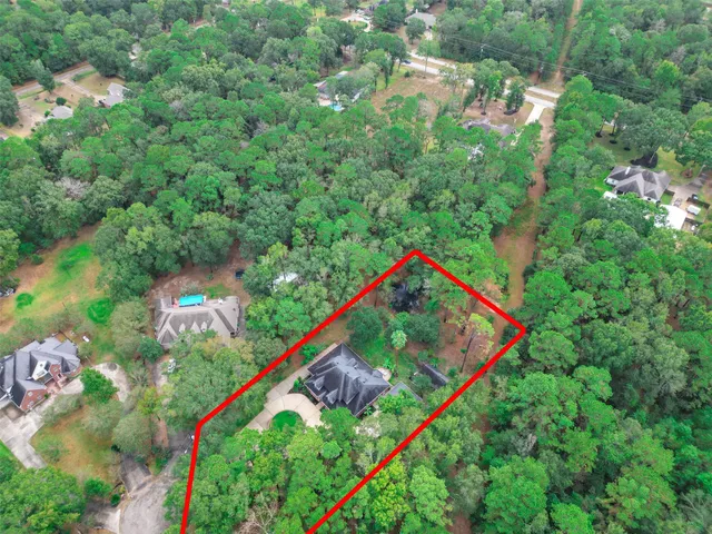 a view of a lake with a lush green field