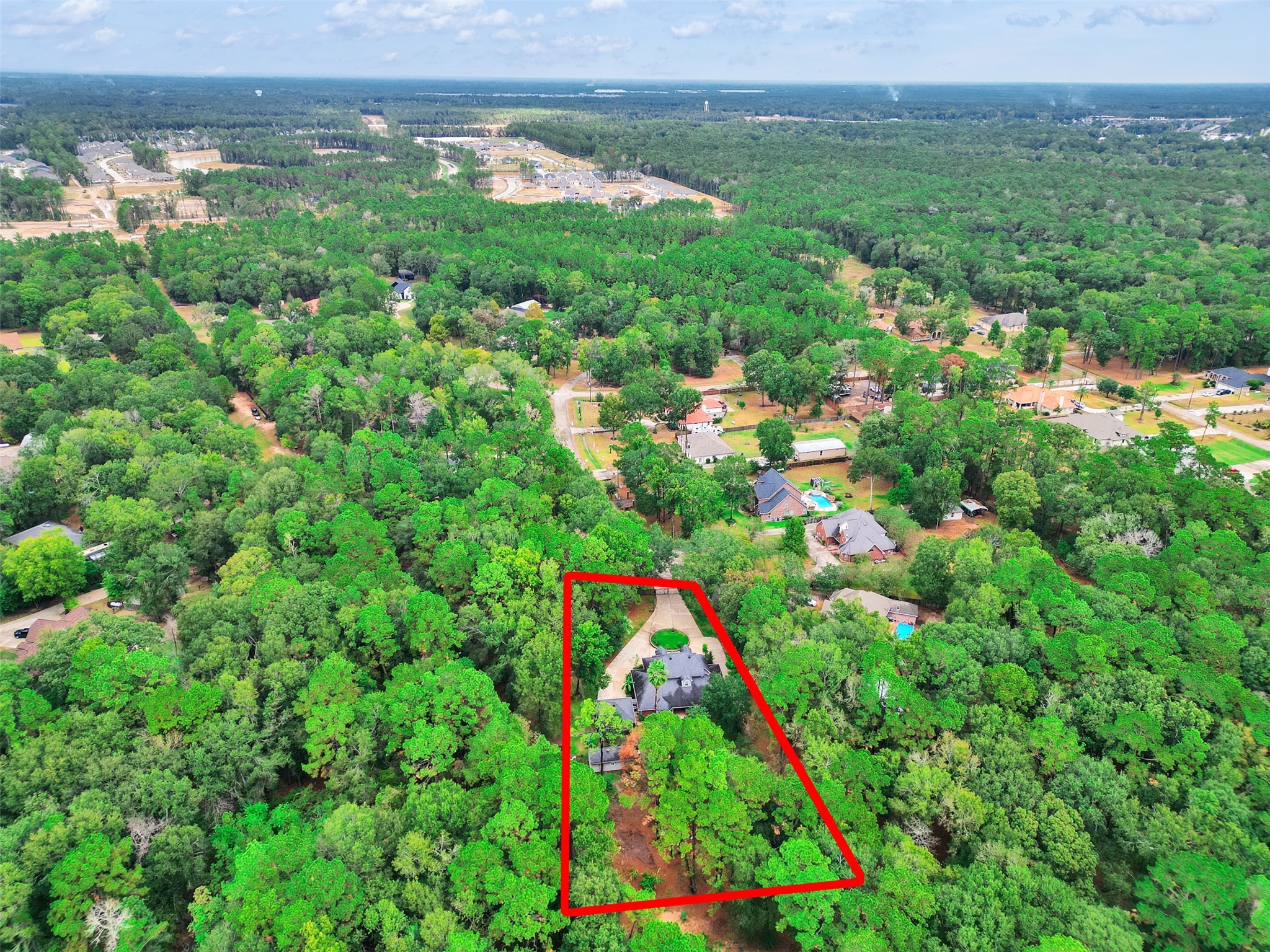 22872 Mersey Court Porter, TX 77365 - Photo 47 of 48 a view of a lake with a lush green field