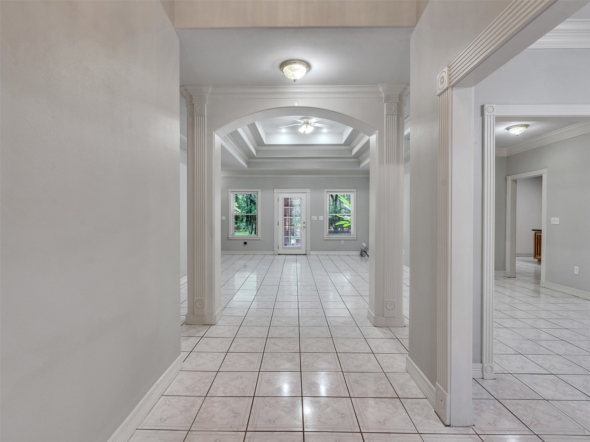 22872 Mersey Court Porter, TX 77365 - Photo 7 of 48 a view of a hallway with wooden floor and a chandelier