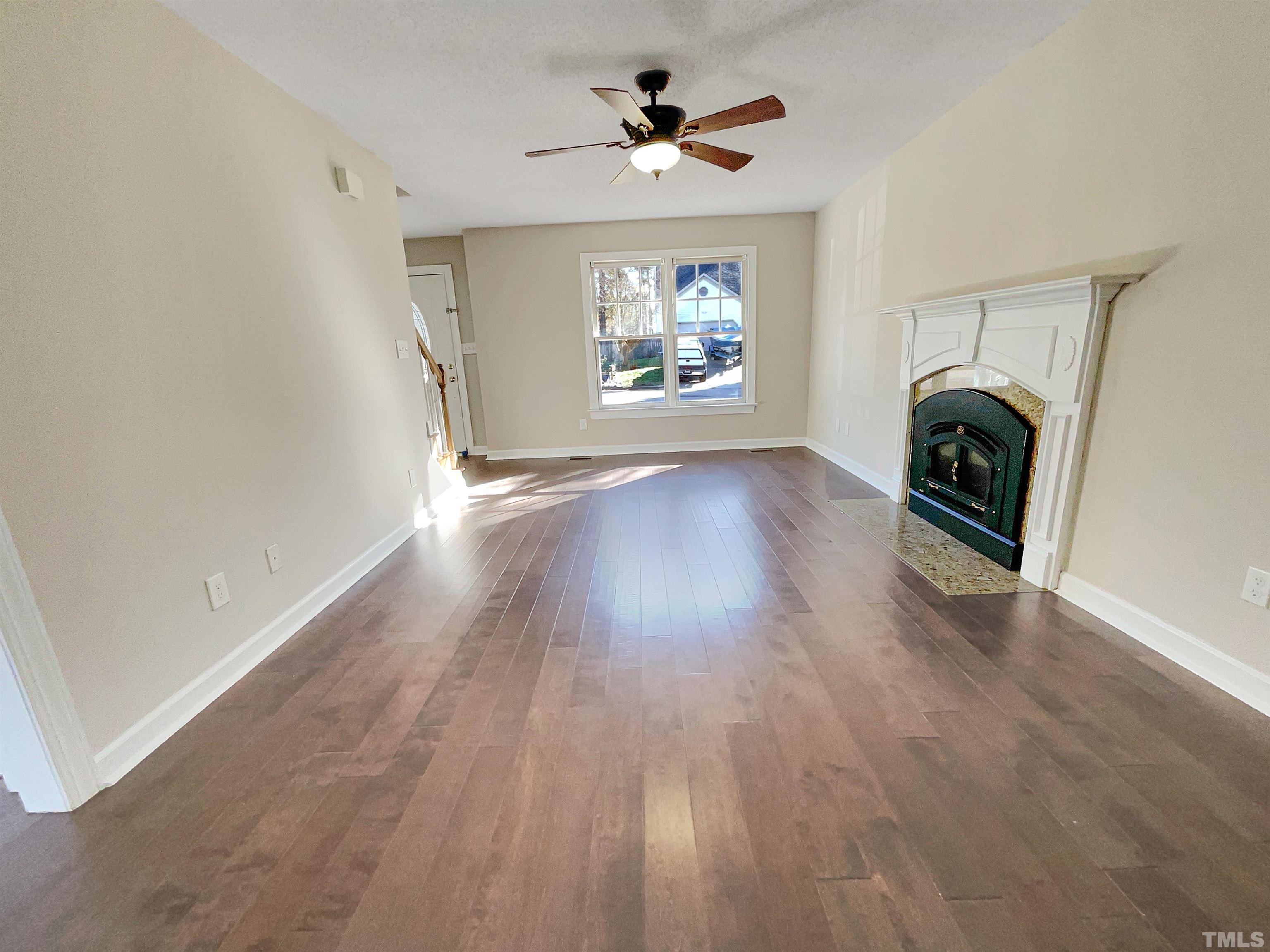 6017 Tarleton Court Raleigh, NC 27616 - Photo 23 of 26 wooden floor in an empty room with a window