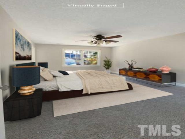6017 Tarleton Court Raleigh, NC 27616 - Photo 25 of 26 a bedroom with a bed and dresser