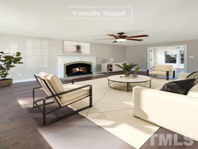 6017 Tarleton Court Raleigh, NC 27616 - Photo 26 of 26 a living room with furniture and a fireplace