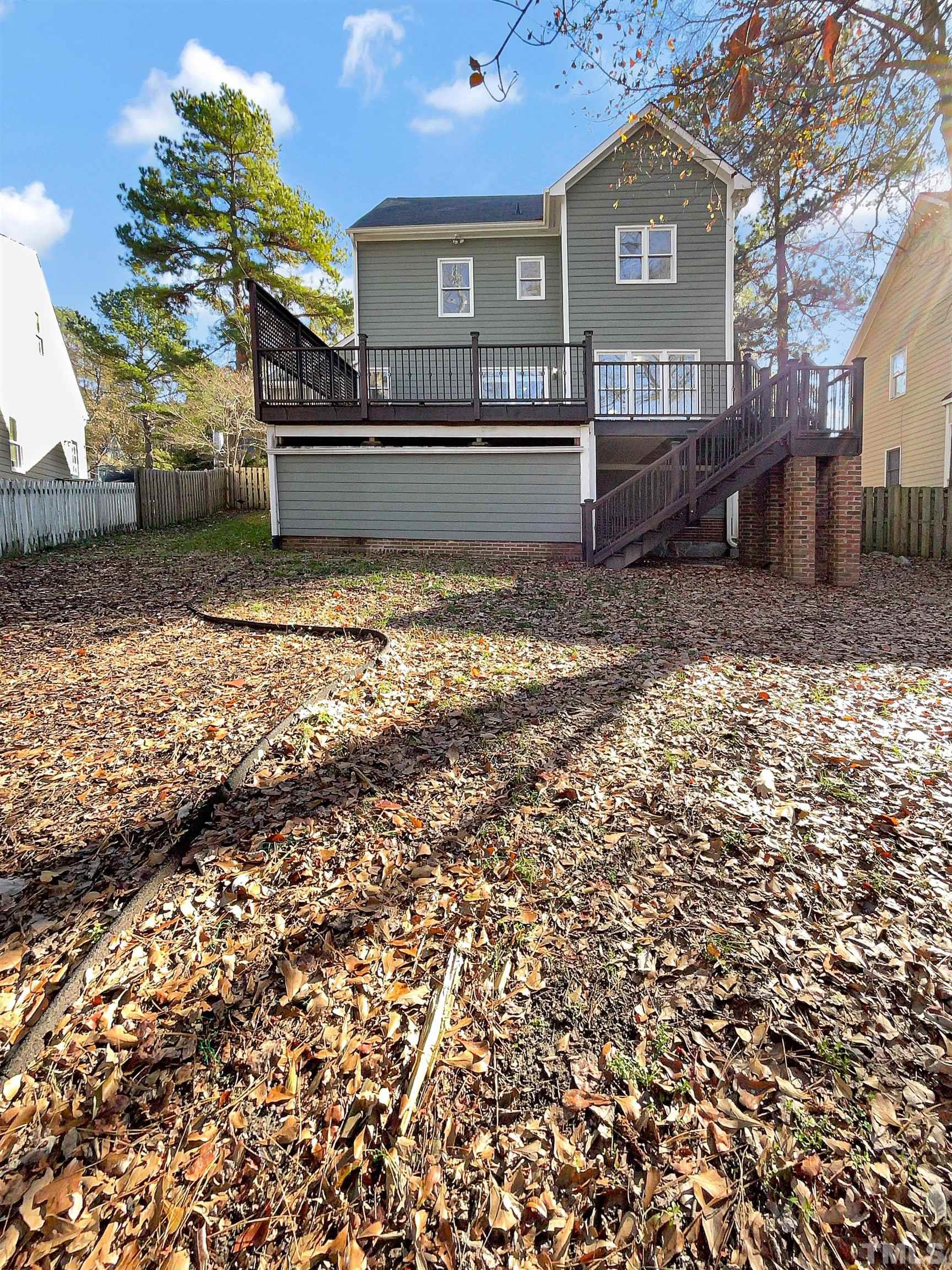6017 Tarleton Court Raleigh, NC 27616 - Photo 5 of 26 a front view of a house with a yard