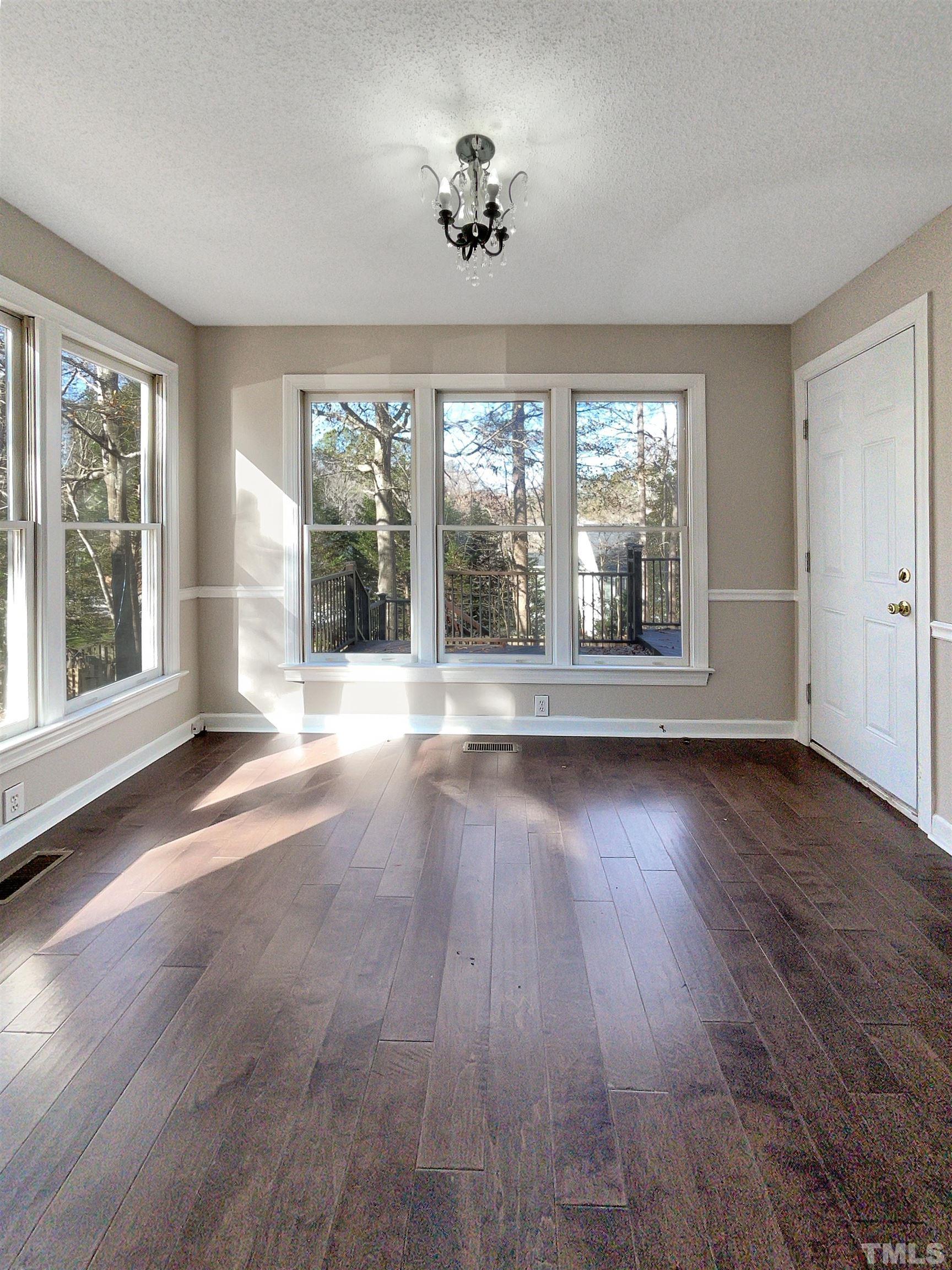 6017 Tarleton Court Raleigh, NC 27616 - Photo 7 of 26 a view of a room with wooden floor and balcony