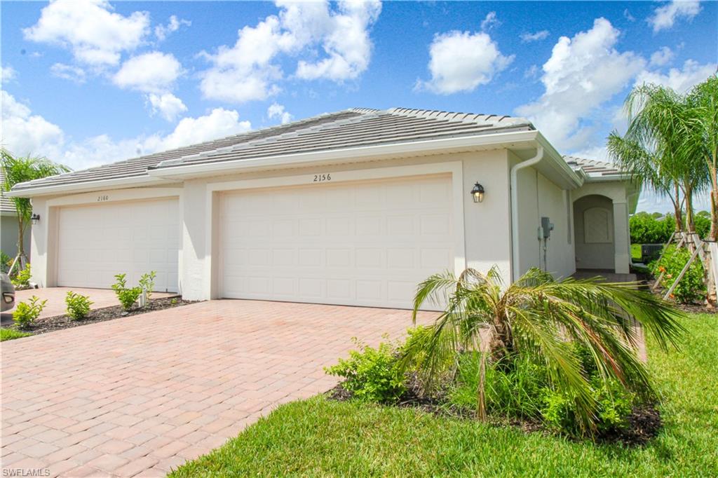2156 Dragonfruit Way Naples, FL 34120 - Photo 11 of 50 View of front of home with a garage