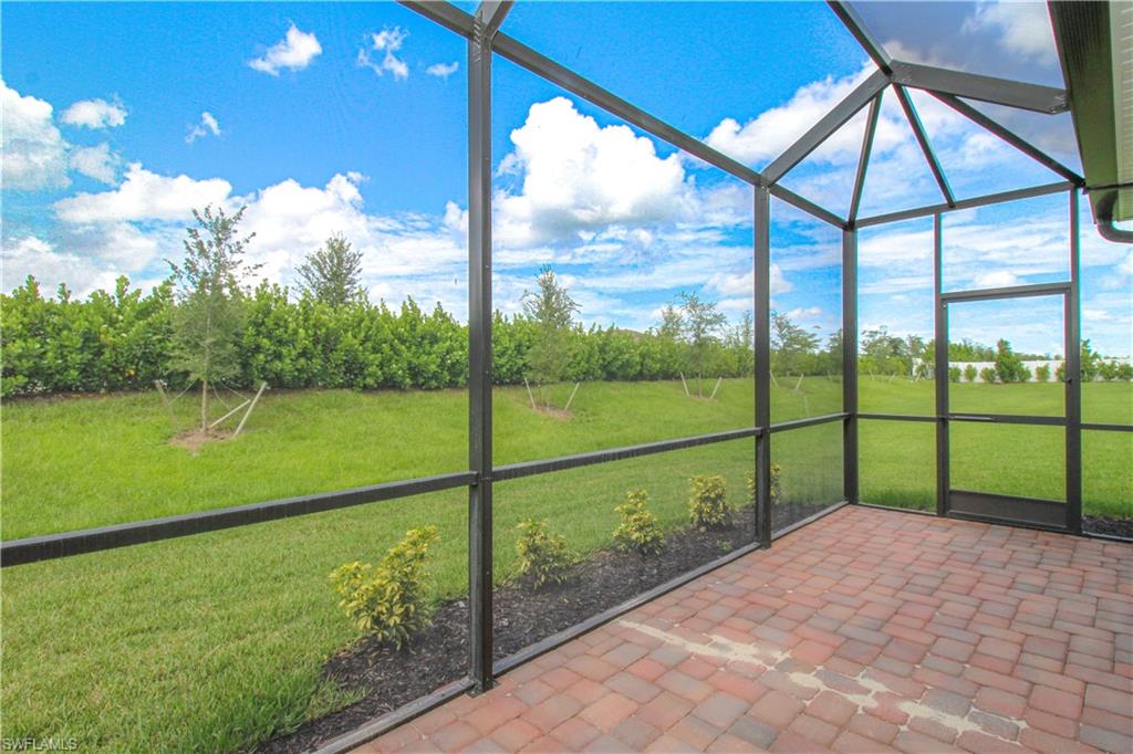 2156 Dragonfruit Way Naples, FL 34120 - Photo 16 of 50 View of unfurnished sunroom
