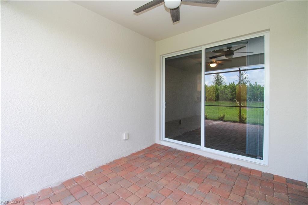 2156 Dragonfruit Way Naples, FL 34120 - Photo 22 of 50 View of patio / terrace featuring ceiling fan