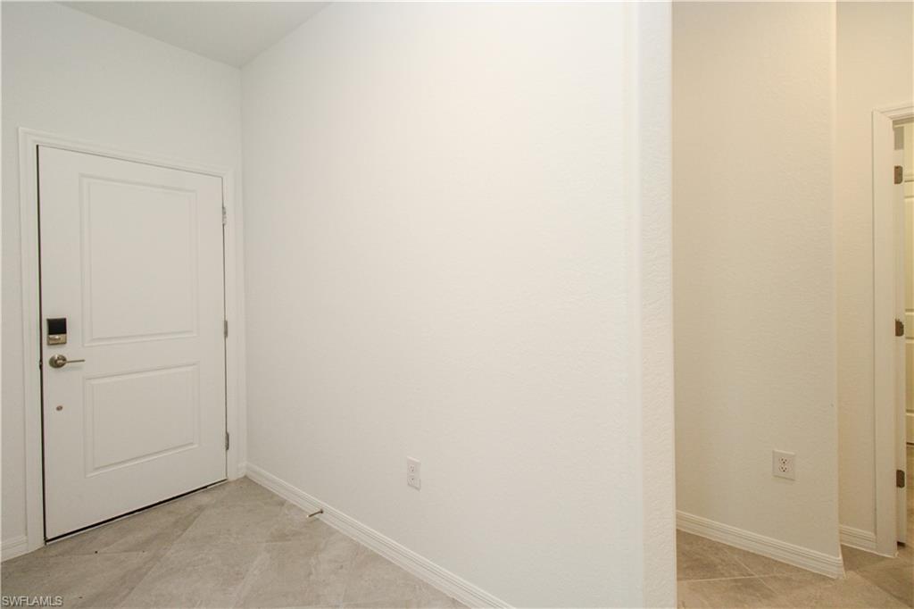 2156 Dragonfruit Way Naples, FL 34120 - Photo 23 of 50 View of tiled empty room