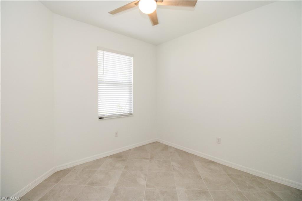 2156 Dragonfruit Way Naples, FL 34120 - Photo 26 of 50 Tiled empty room featuring ceiling fan