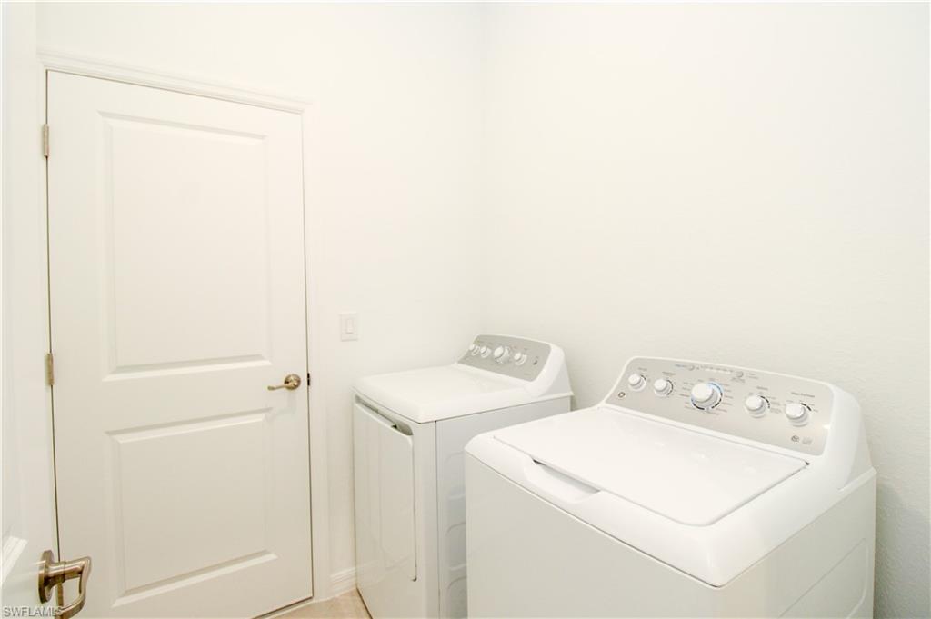 2156 Dragonfruit Way Naples, FL 34120 - Photo 29 of 50 Washroom with washing machine and dryer
