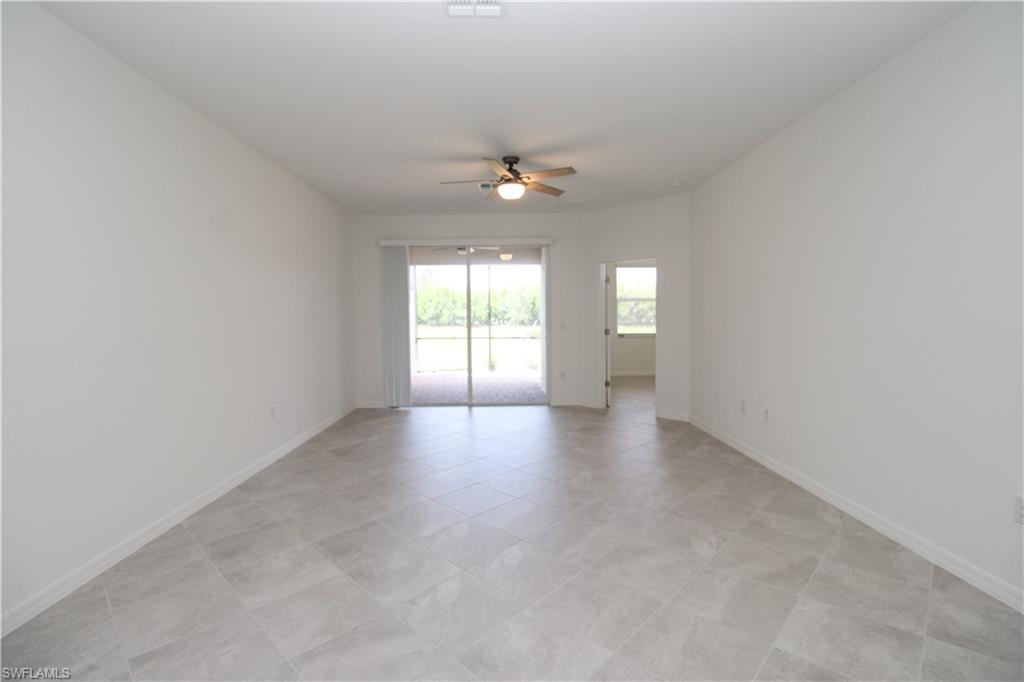 2156 Dragonfruit Way Naples, FL 34120 - Photo 42 of 50 Tiled spare room with ceiling fan