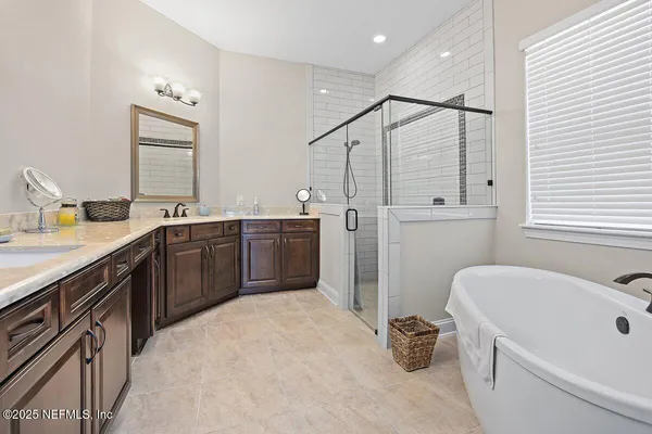 a kitchen with a sink appliances and cabinets