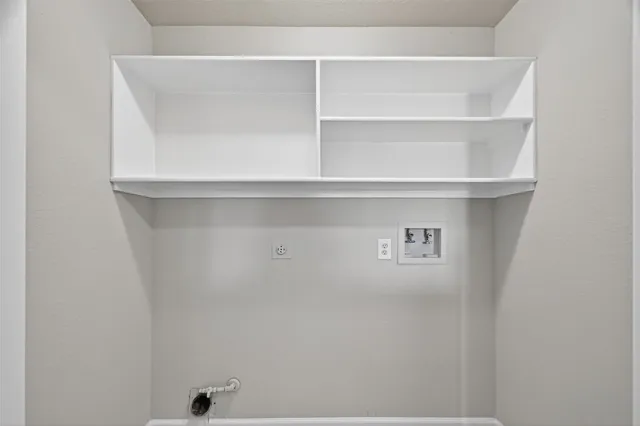 a view of an empty room with a ceiling fan