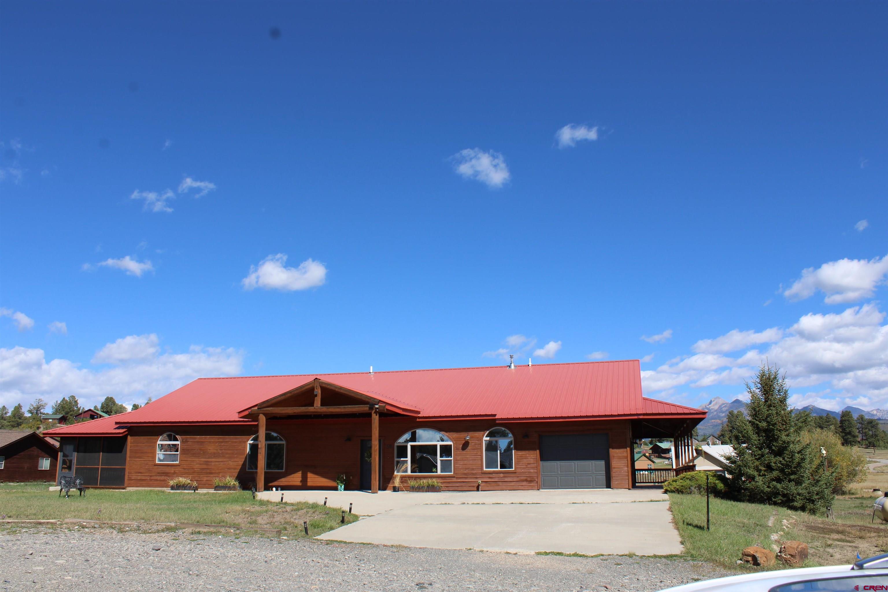59 Rincon Court Pagosa Springs, CO 81147 - Photo 2 of 37 a front view of house with yard