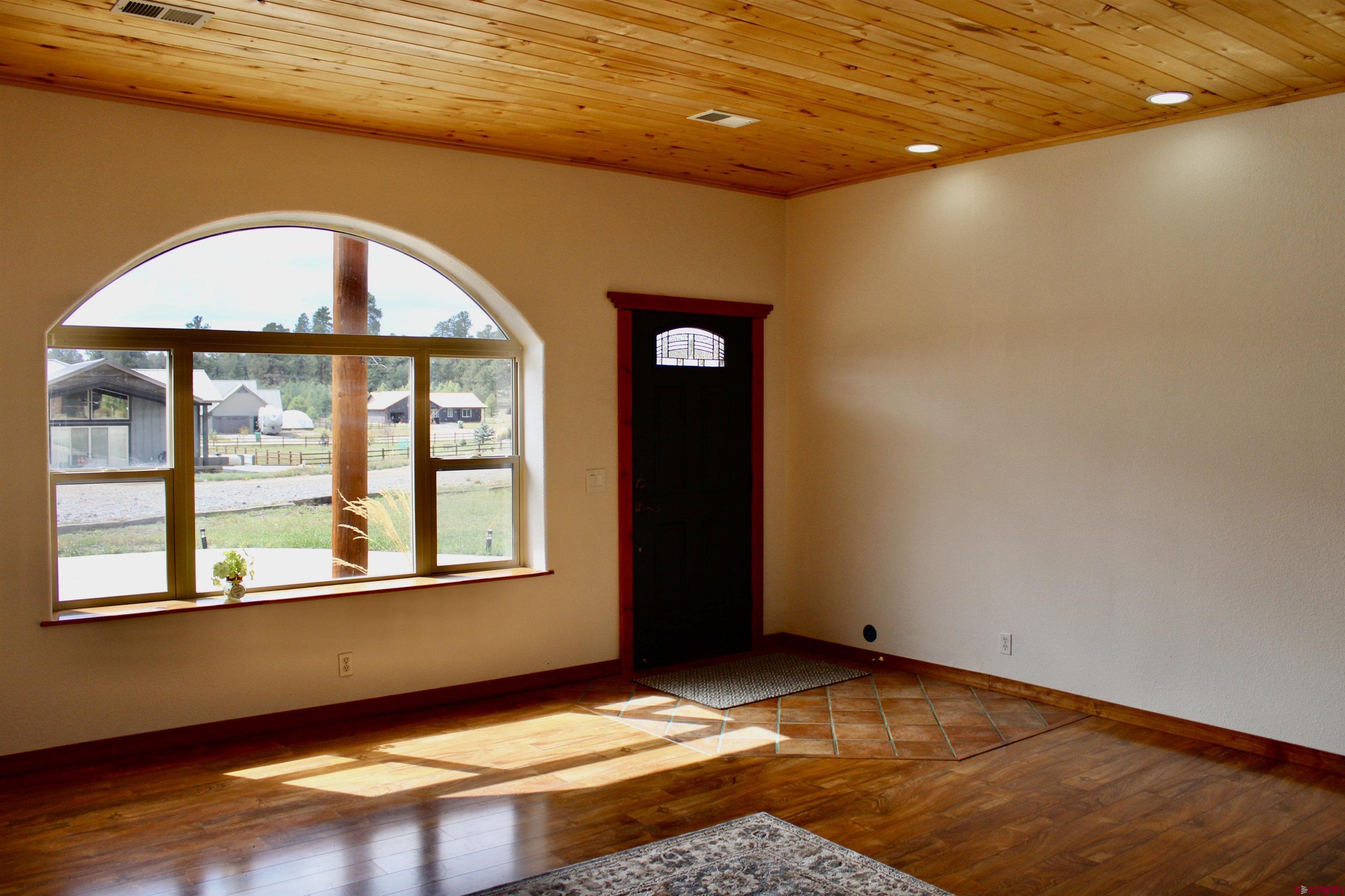 59 Rincon Court Pagosa Springs, CO 81147 - Photo 3 of 37 a view of an empty room with a window