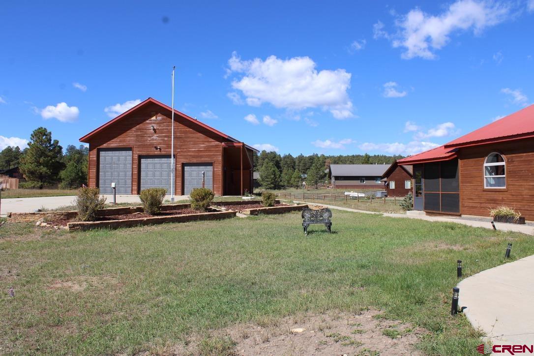 59 Rincon Court Pagosa Springs, CO 81147 - Photo 31 of 37 a view of a house with backyard porch and sitting area