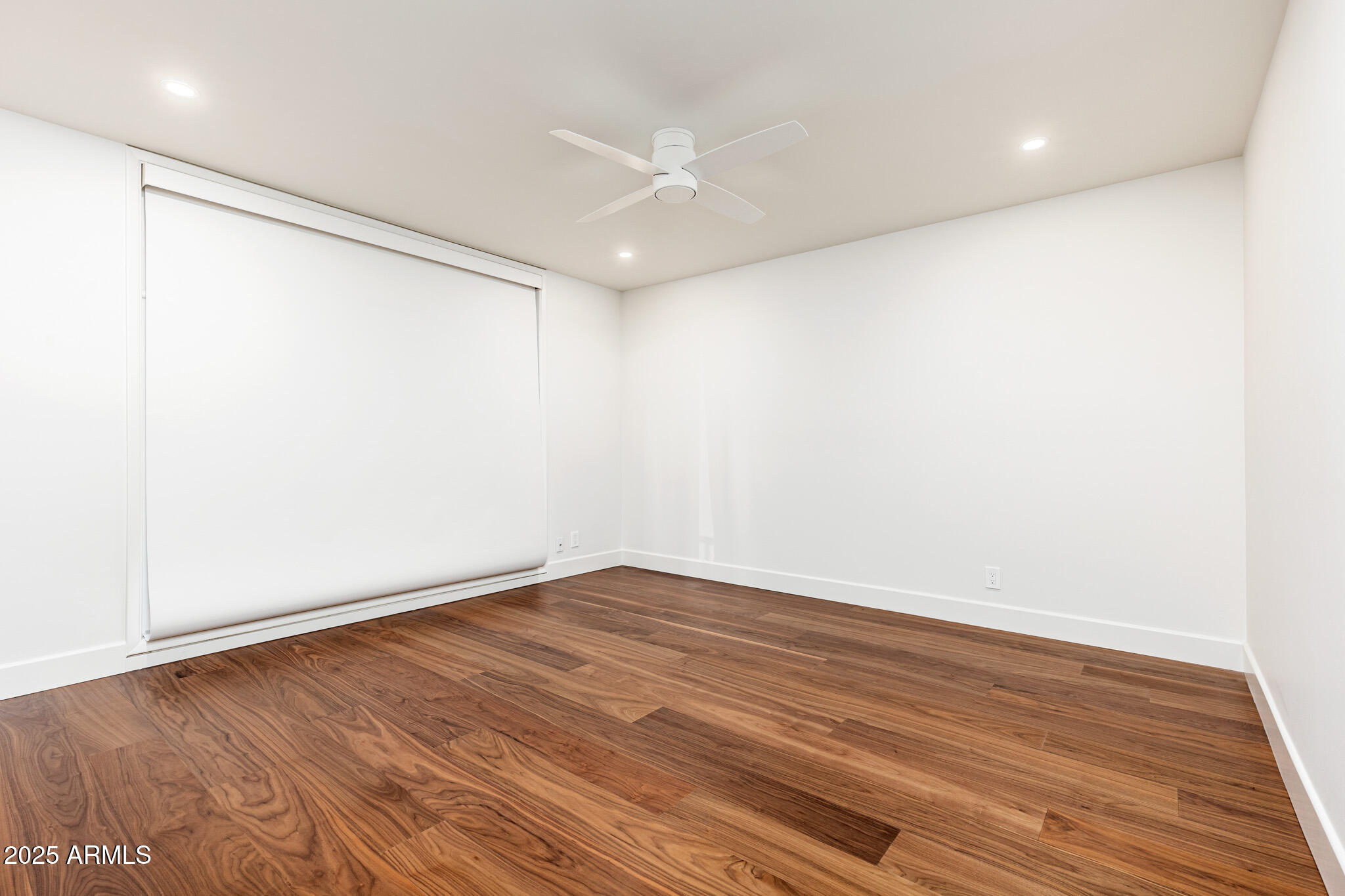 3736 East Montecito Avenue Phoenix, AZ 85018 - Photo 15 of 42 a view of an empty room with wooden floor