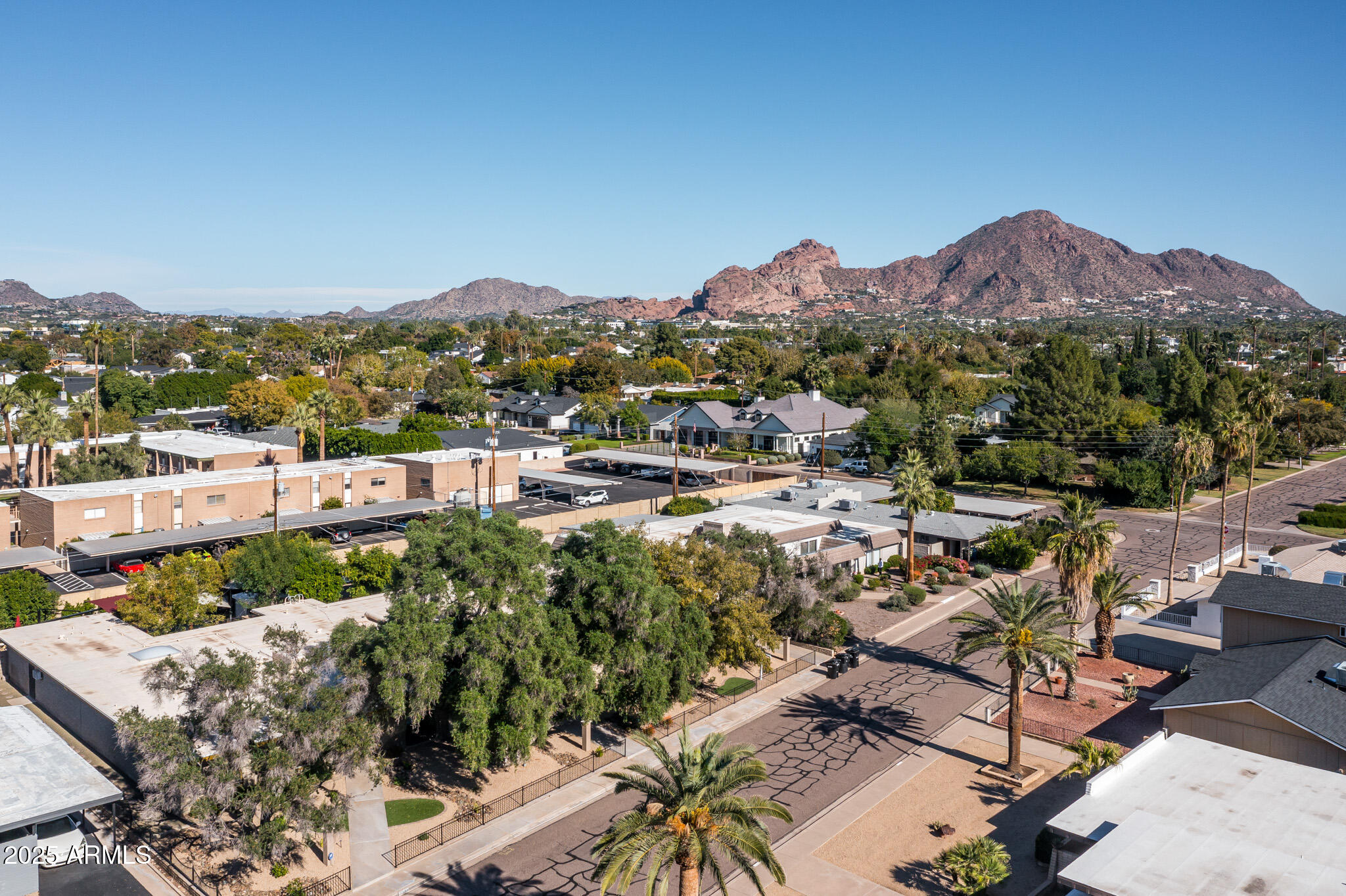 3736 East Montecito Avenue Phoenix, AZ 85018 - Photo 40 of 42 a view of a terrace with a table and chairs