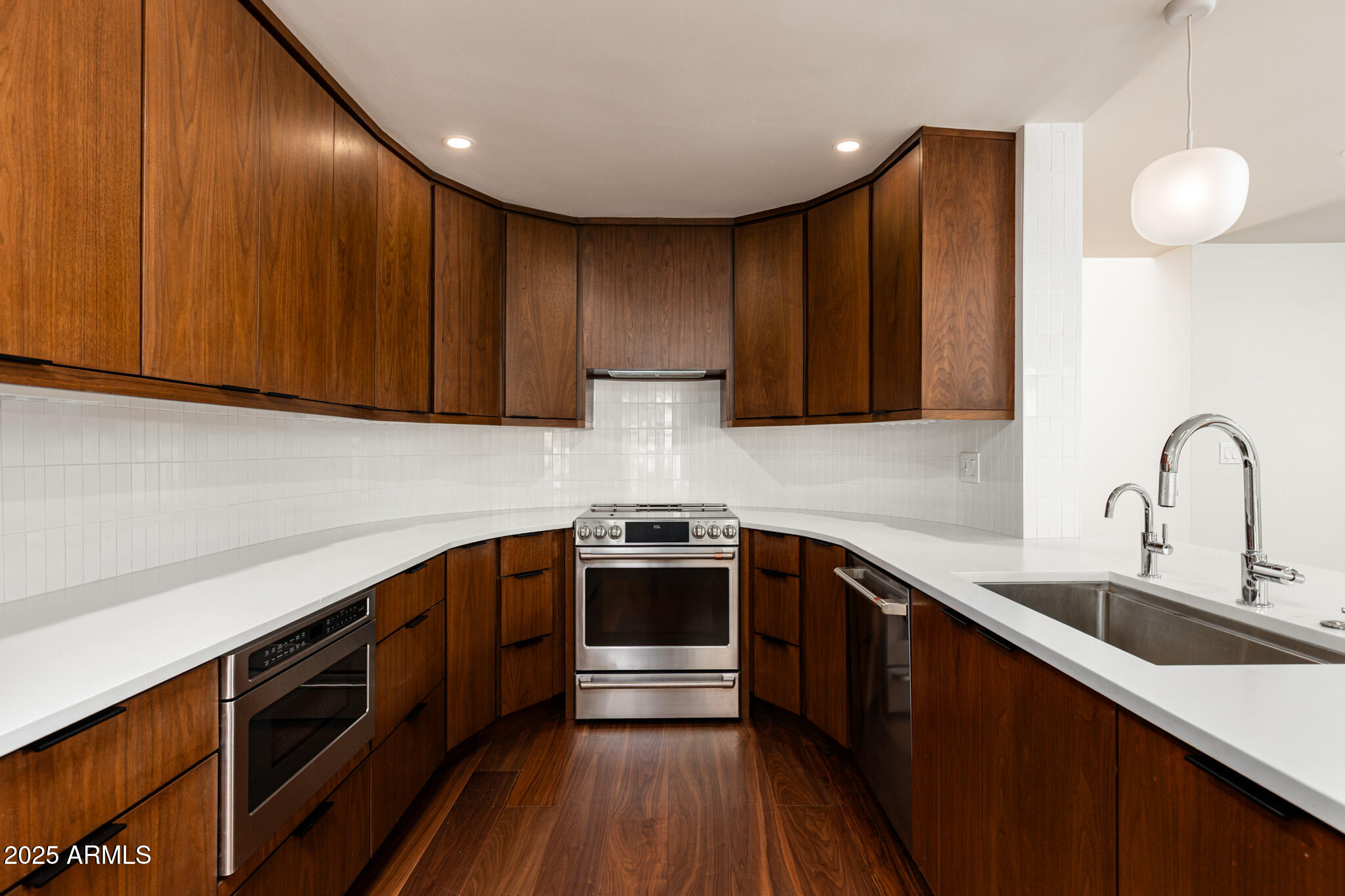 3736 East Montecito Avenue Phoenix, AZ 85018 - Photo 5 of 42 a kitchen with a sink cabinets and stainless steel appliances