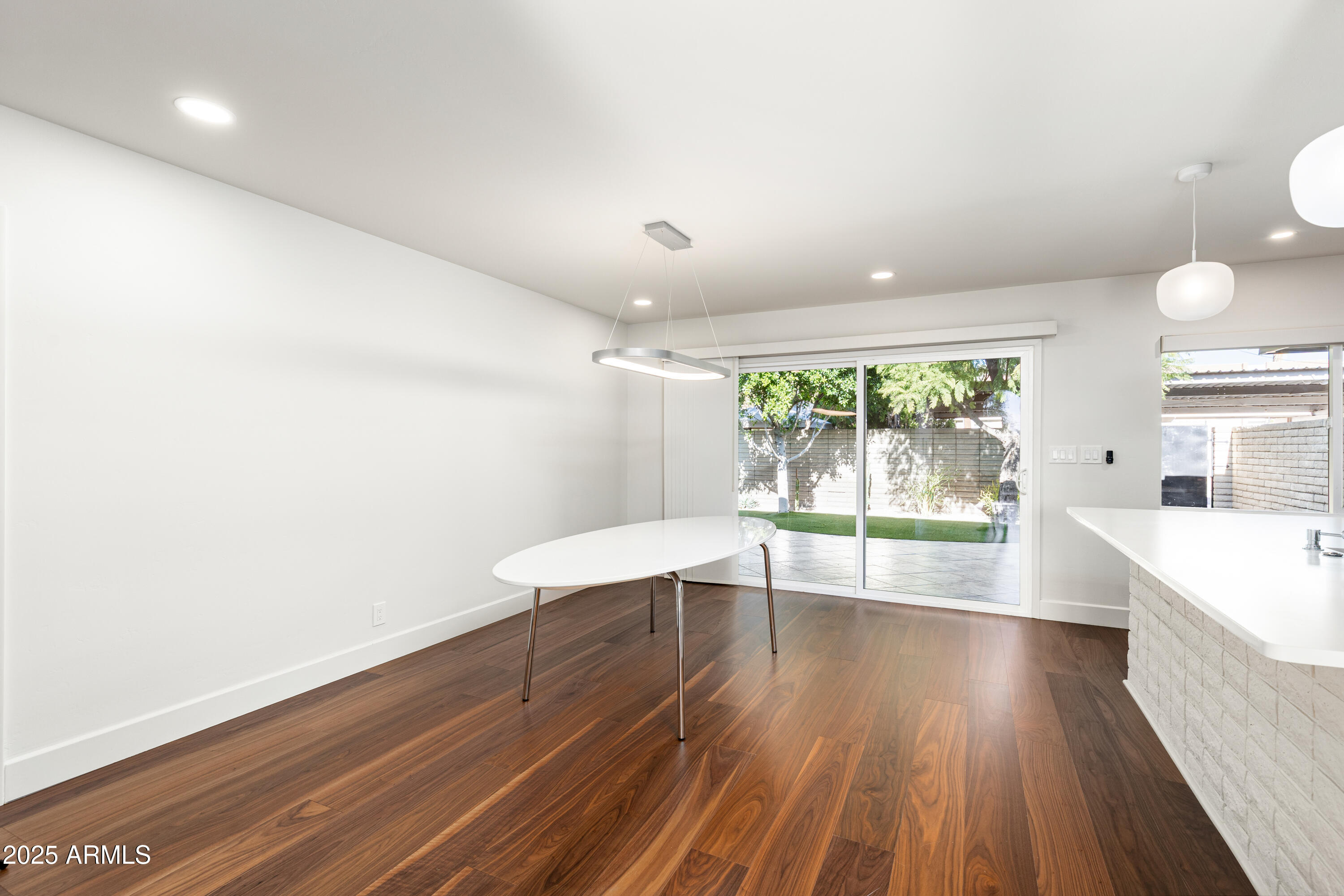 3736 East Montecito Avenue Phoenix, AZ 85018 - Photo 9 of 42 a view of room with window and wooden floor