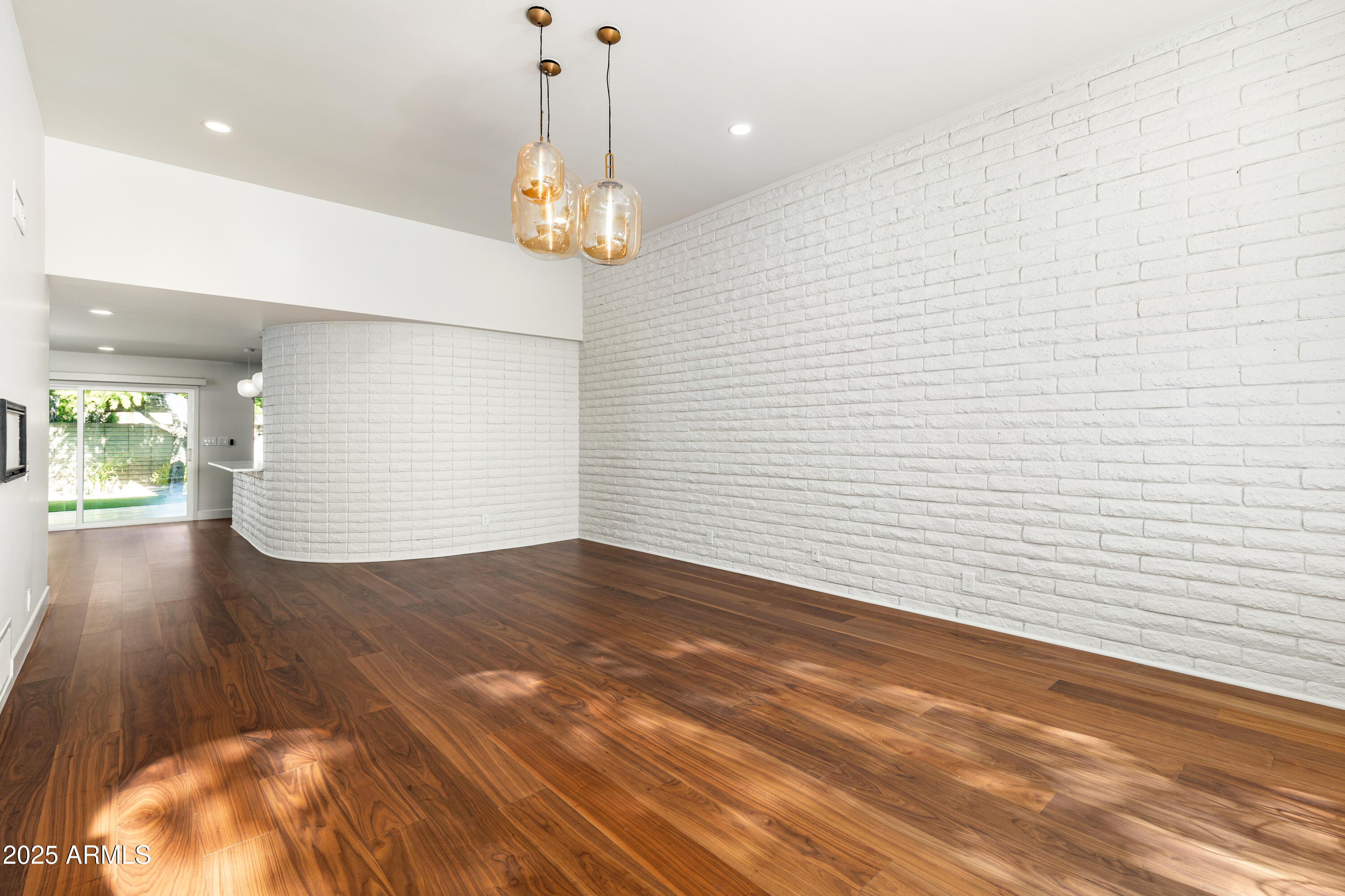 3736 East Montecito Avenue Phoenix, AZ 85018 - Photo 10 of 42 a view of a room with a wooden floor