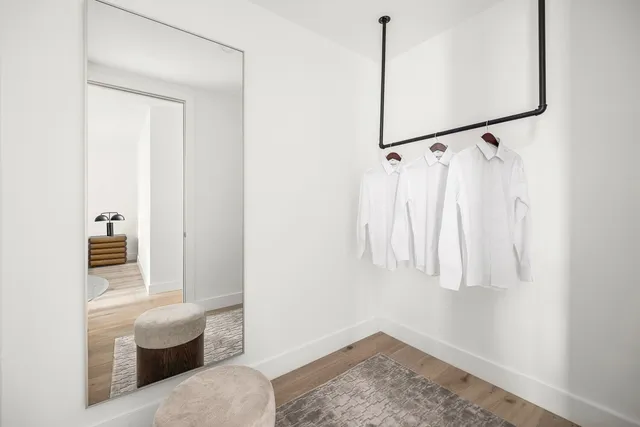a bathroom with a double vanity sink and mirror