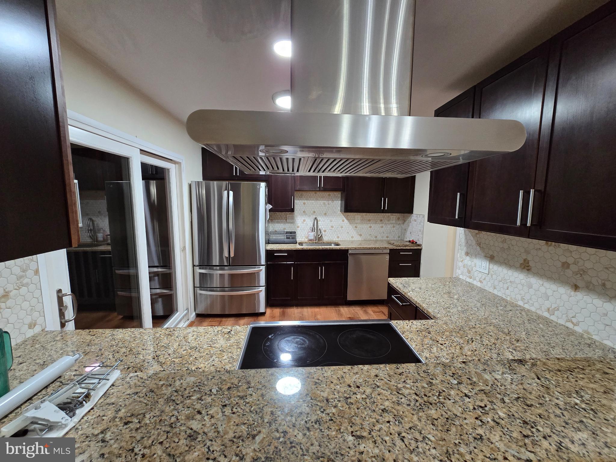 20000 Wyman Way Germantown, MD 20874 - Photo 4 of 56 a kitchen with stainless steel appliances granite countertop a sink a stove and a refrigerator