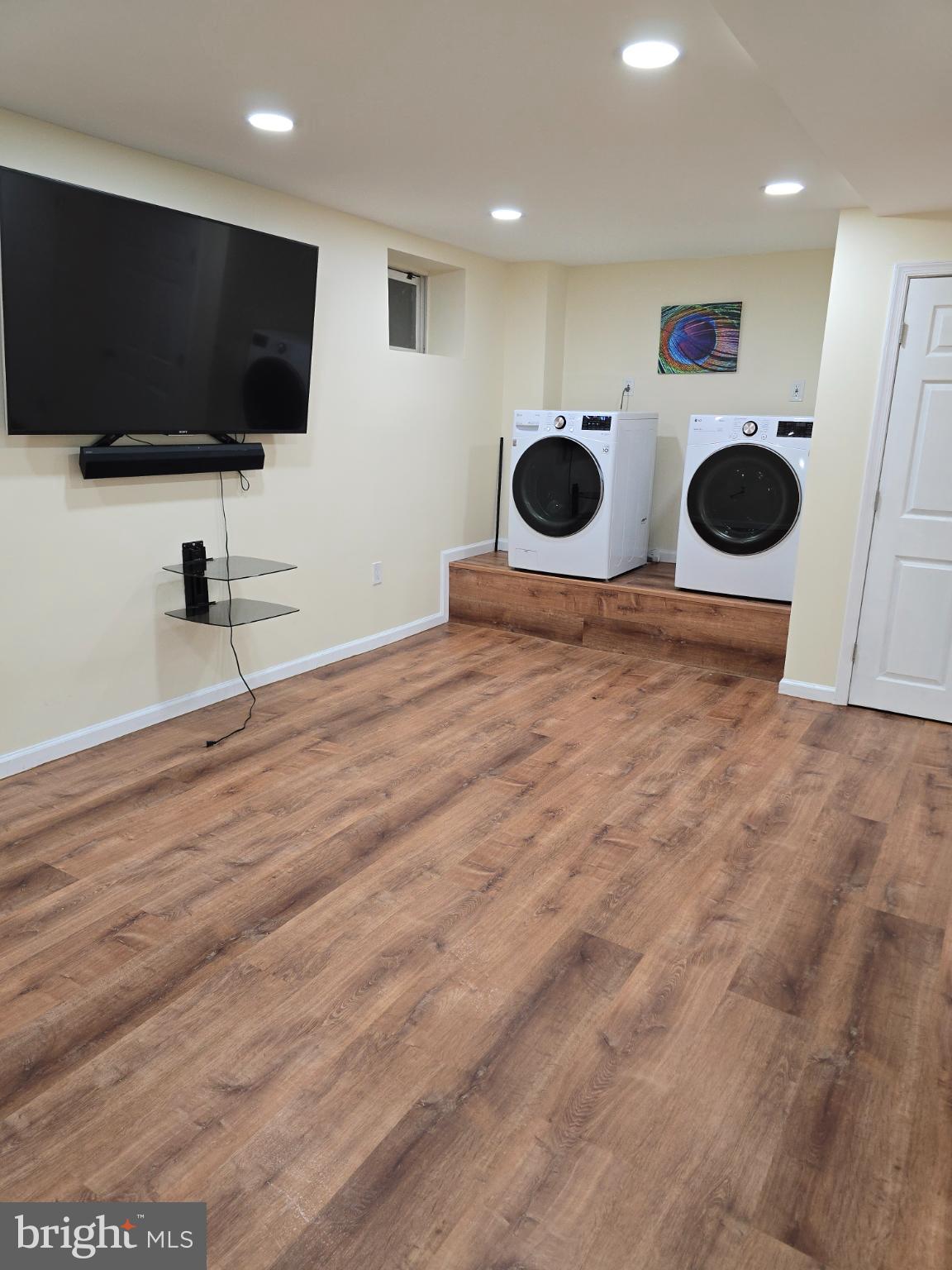 20000 Wyman Way Germantown, MD 20874 - Photo 44 of 56 a view of a kitchen with a flat screen tv and a fireplace