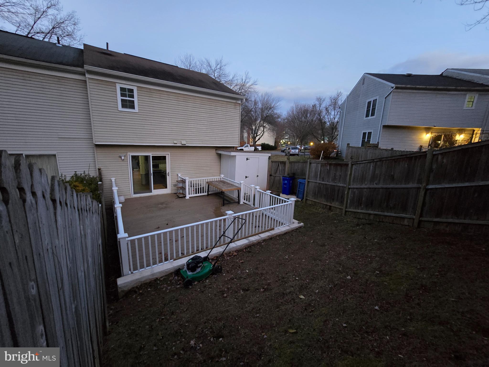 20000 Wyman Way Germantown, MD 20874 - Photo 48 of 56 a view of a house with a small yard and wooden fence