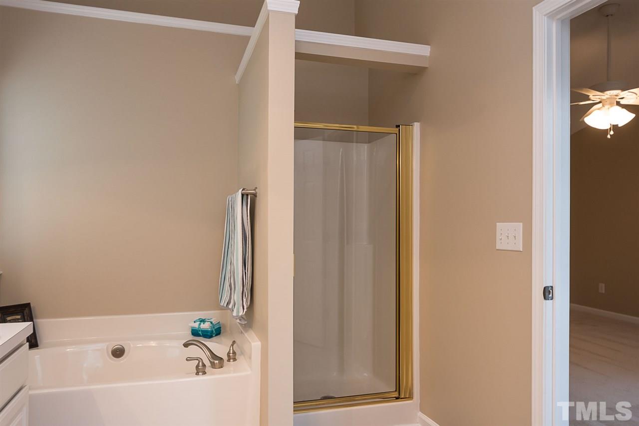 3809 Toyon Drive Raleigh, NC 27616 - Photo 15 of 20 a bathroom with a bathtub